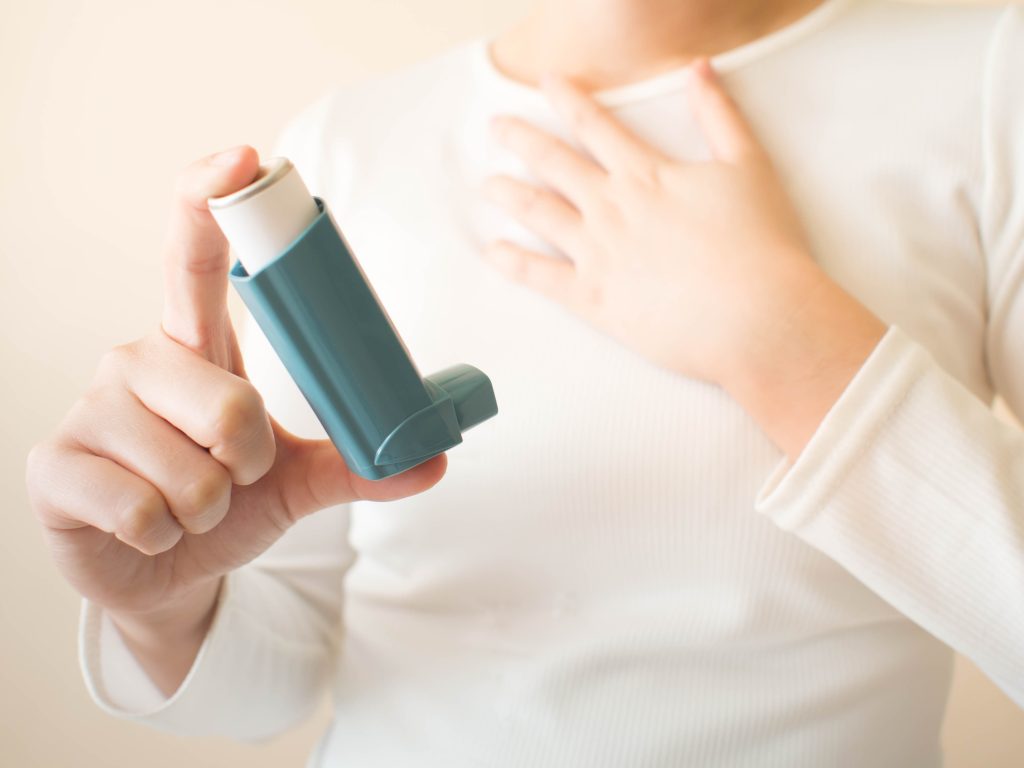 Person using an inhaler